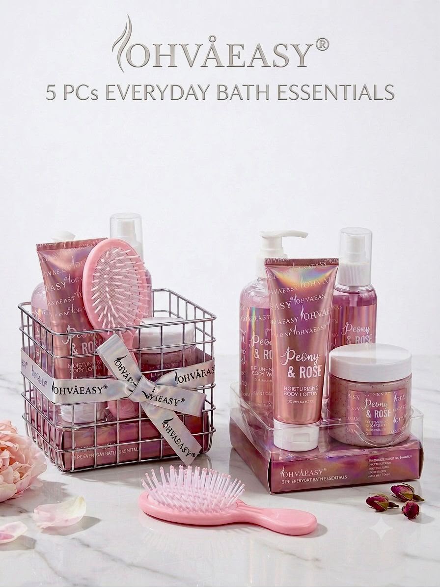A set of OHVÅEASY everyday bath essentials arranged on a light marble surface, including pink and rose-toned tubes, bottles, a jar, a wire basket, and a pink hairbrush. Text at the top reads 'OHVÅEASY 5 PCS EVERYDAY BATH ESSENTIALS'.